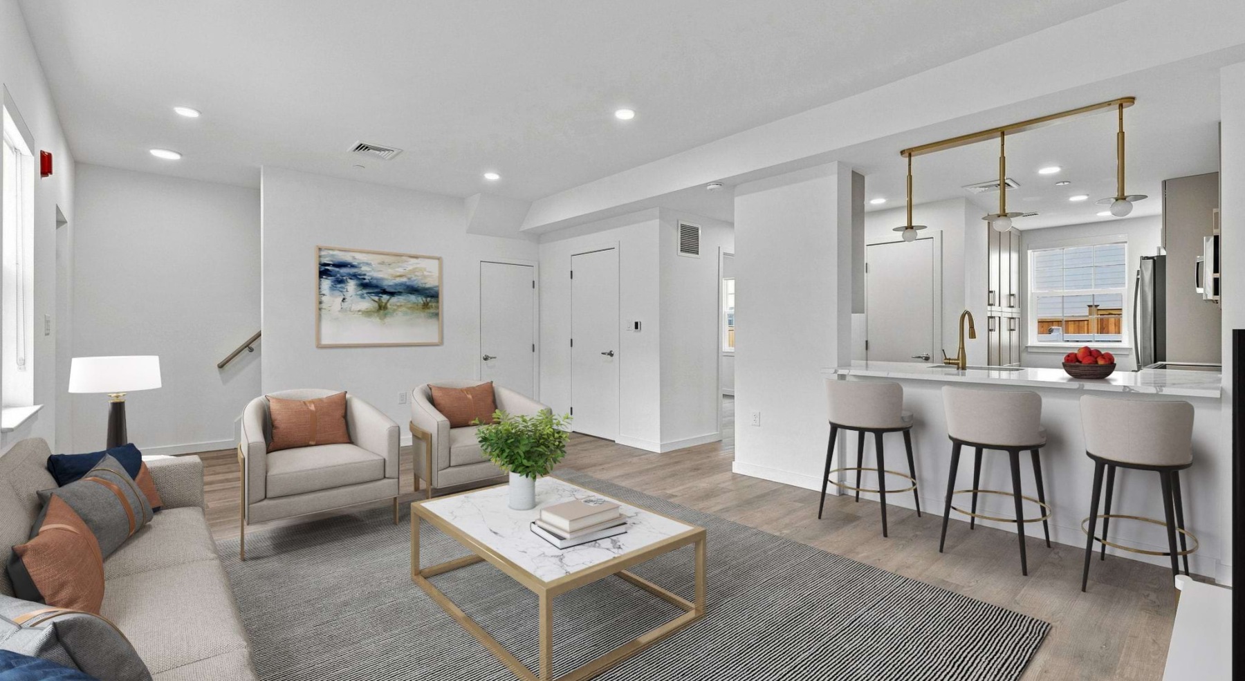 living room with furniture and view of a kitchen