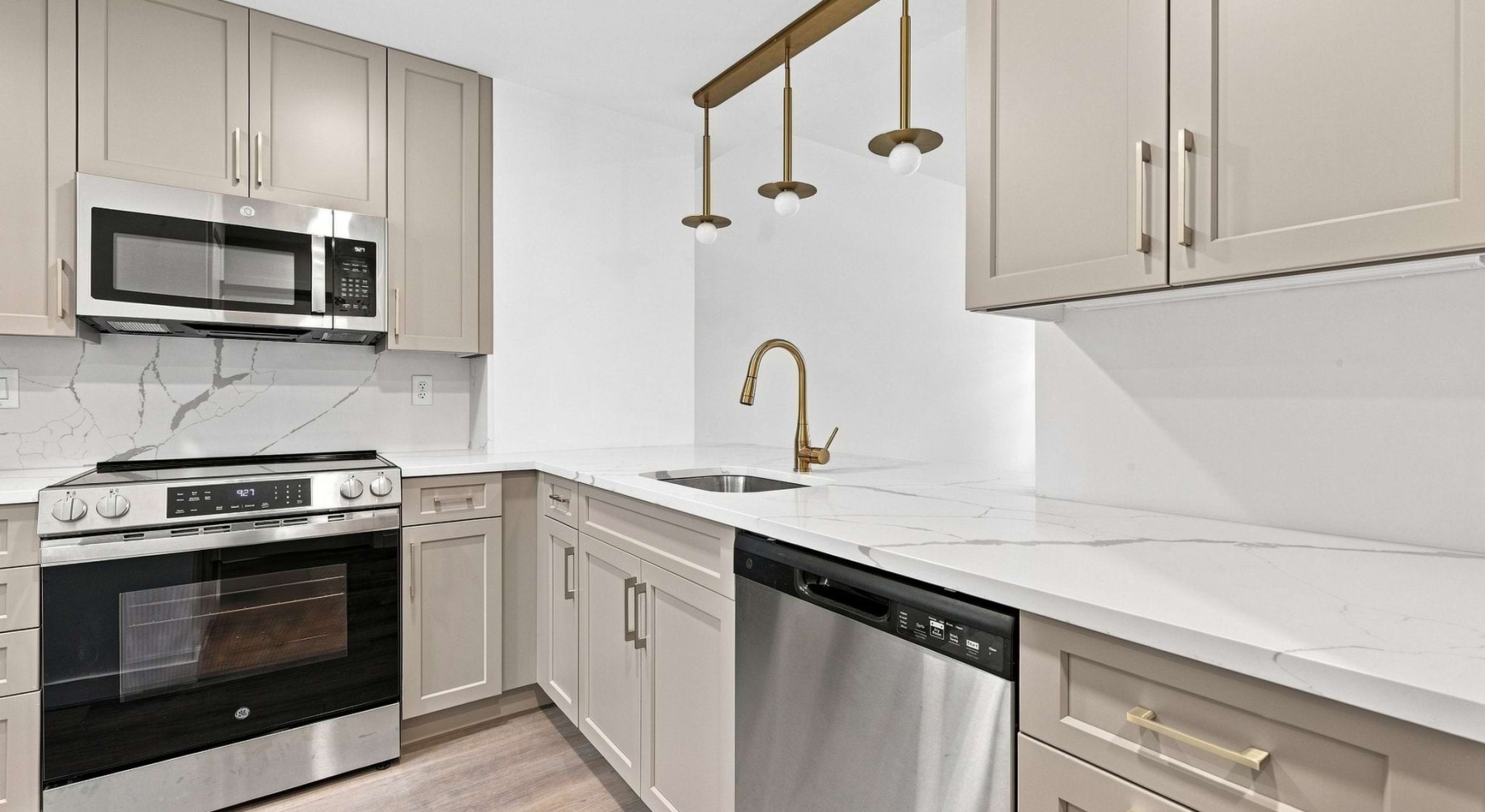 kitchen with stainless steel appliances and beige cupboards