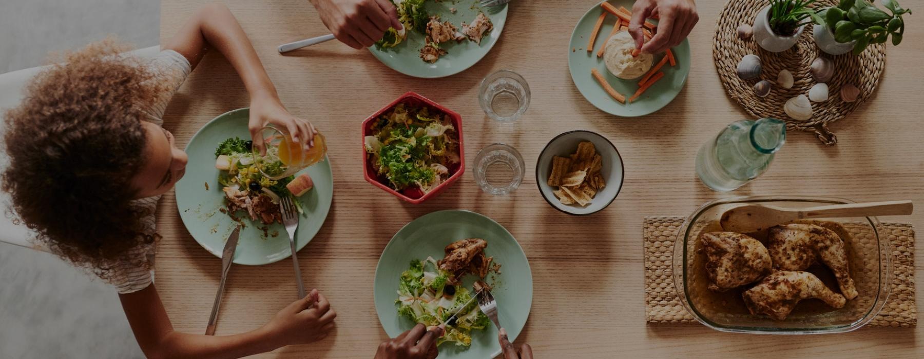 a group of people eating at a table