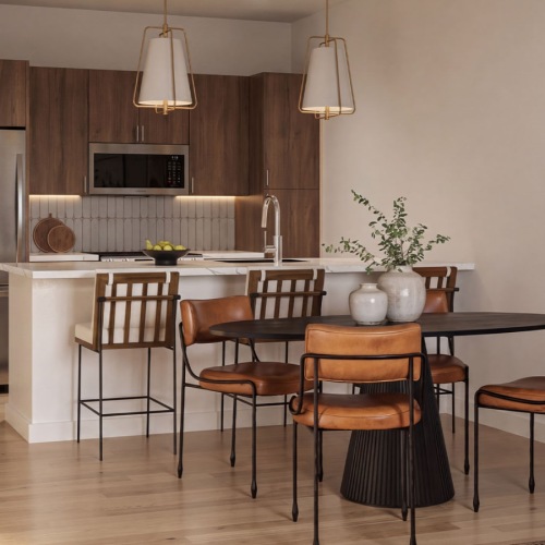 a kitchen with a table and chairs