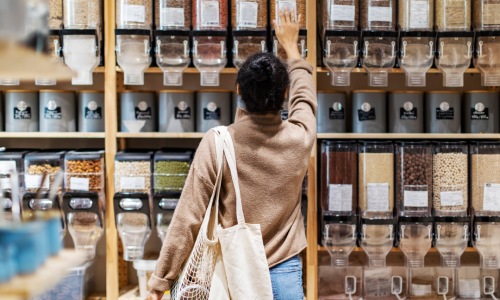 a person shopping looking at bulk food