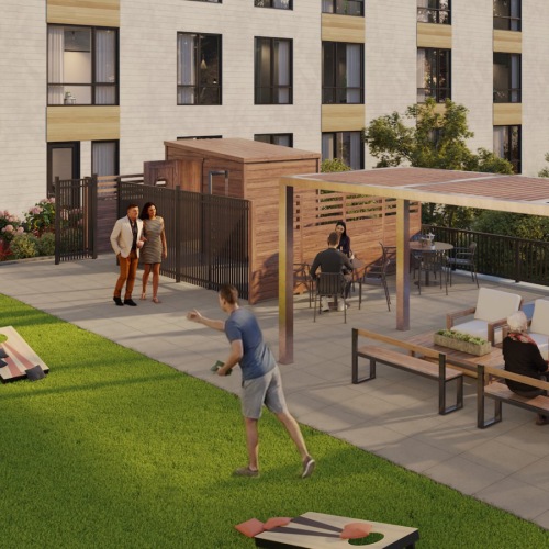 an activity field with corn hole and seating areas
